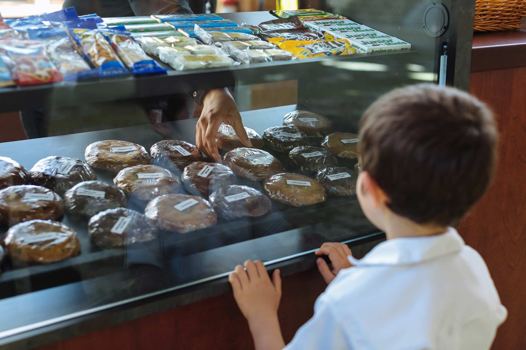 Young patron eyeing the sweet treats at concessions