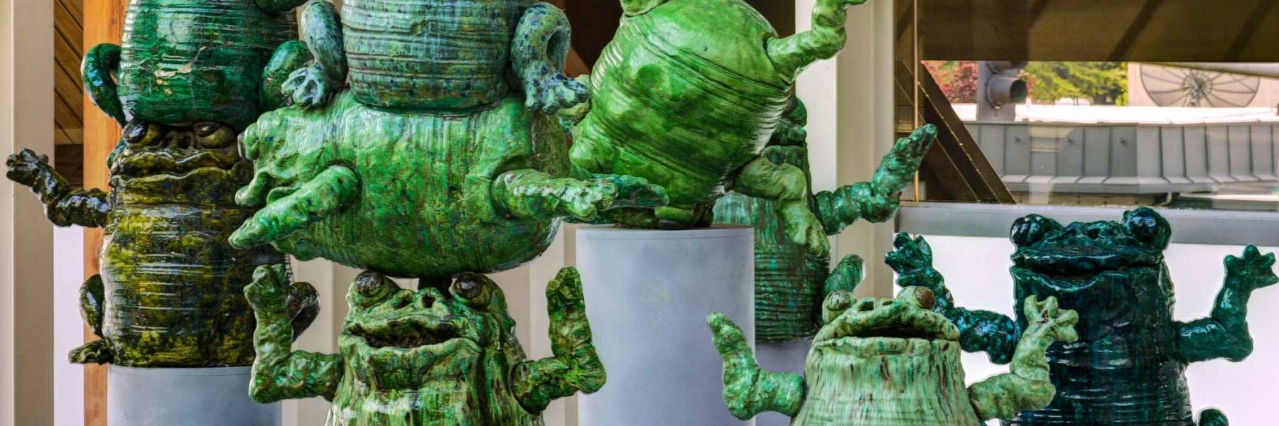 Ceramic green statues of frogs from the Hult Center Lobby