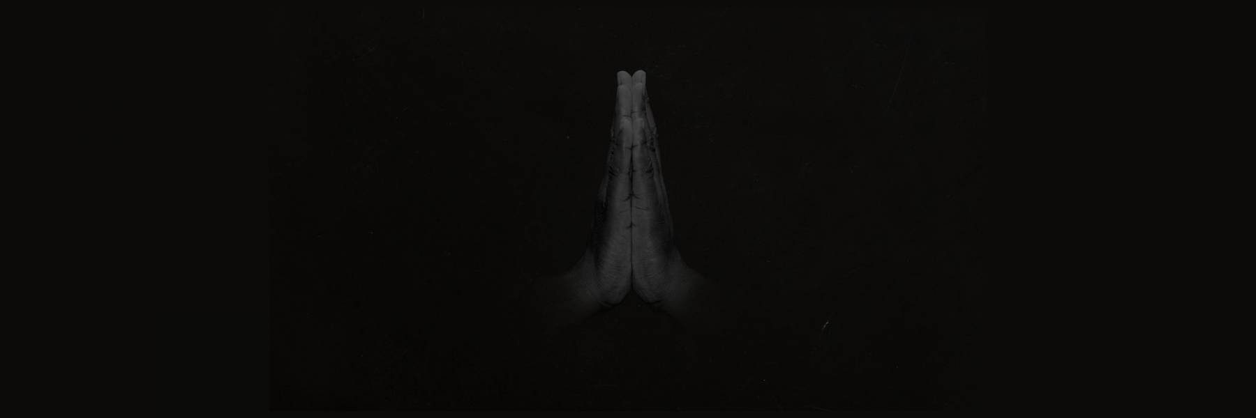 Image of two hands touching