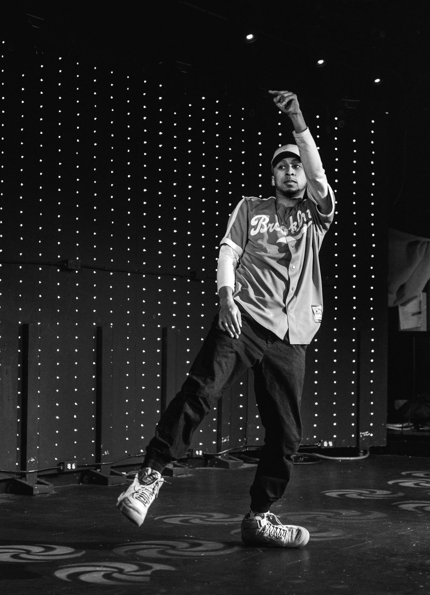 Black and white image of a dancer dancing on stage