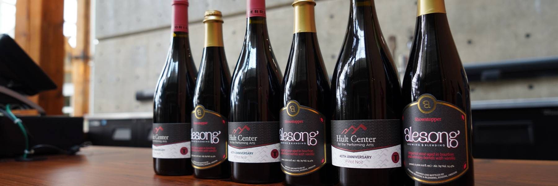 6 bottles of special drinks lined up on table