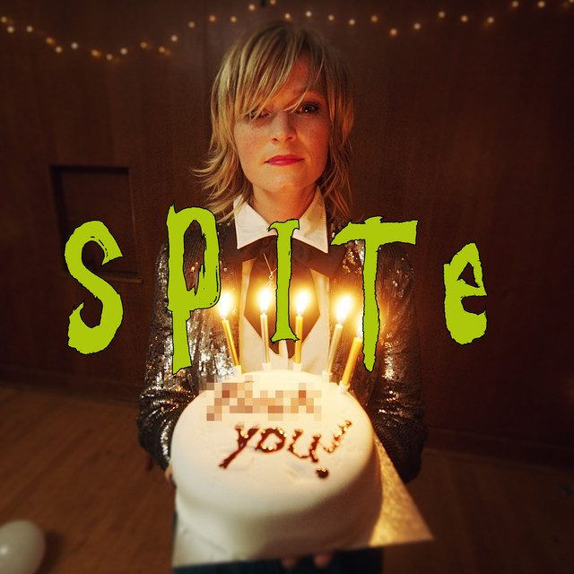 Image of a woman holding a cake with text 